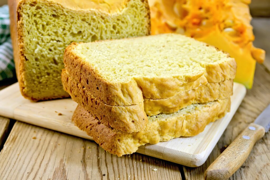 Bread pumpkin homemade with knife on wooden board